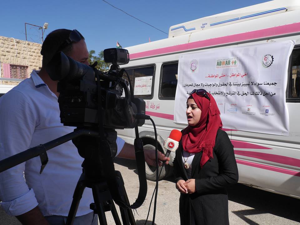  Ma’an News agency media report about the mobile car activity which Roles for social change association –ADWAR carried out in partnership with Unions women’s committees for social work within media campaign entitled “ me and you one home”