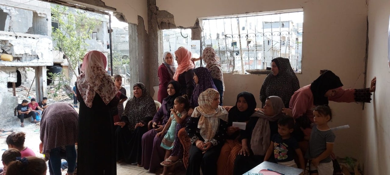  Inside a bombed house, ADWAR implemented an awareness meeting in Beit Hanoun